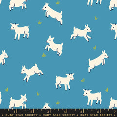Pattern of baby goats on a blue background with ruler