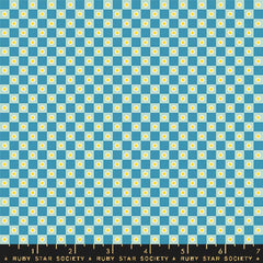Checkered pattern with blue and light blue squares with small flowers with ruler