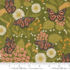 Pattern of butterflies and flowers on a green background with ruler