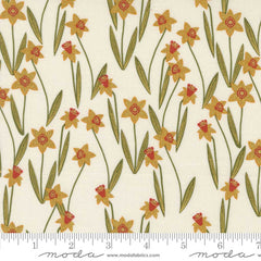 Pattern of yellow flowers with red centers on a beige background with ruler