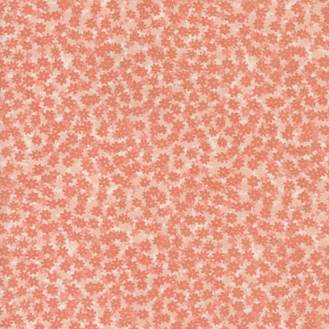 Pattern of small pink flowers on a pink background