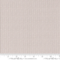 white fabric texture with a herringbone pattern with ruler