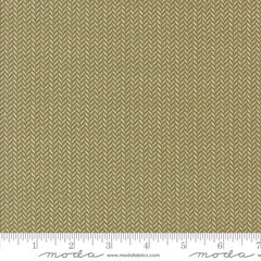 Green fabric texture with a herringbone pattern with ruler