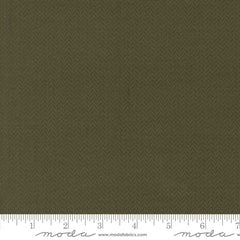 Solid olive green color swatch with ruler