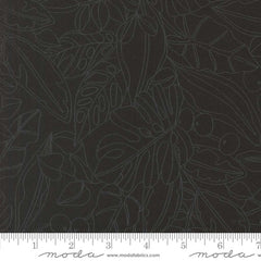 Patterned fabric with leaves and berries on a black background with ruler