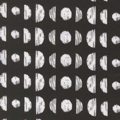 Pattern of white circles and semi-circles on a black background