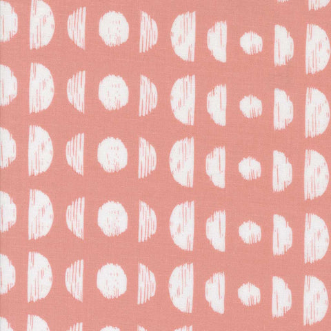 Pattern of white circles and semi-circles on a pink background