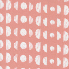 Pattern of white circles and semi-circles on a pink background