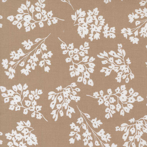 White floral pattern on a brown background