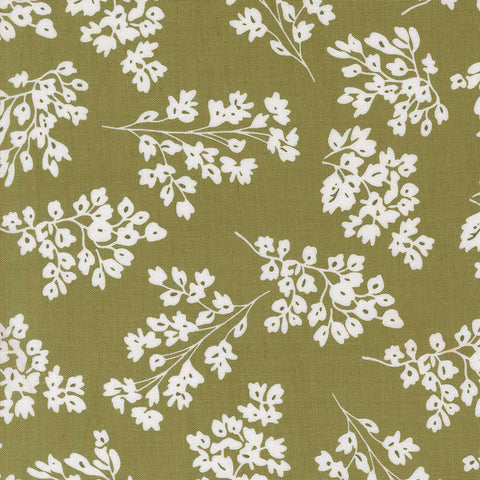 White floral pattern on a green background