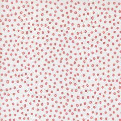 Patterned fabric with small red shapes on a white background
