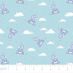 Pattern of Care Bears with clouds, stars, and birds on an aqua background with ruler