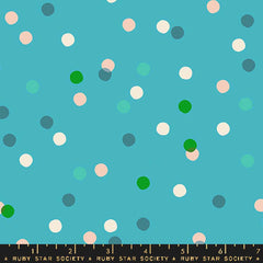 Pattern of colorful dots on a blue background with ruler