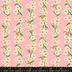 Pattern of white daisies with yellow centers and snails on a pink background with ruler