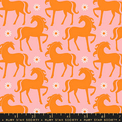 Pattern of orange horses and white flowers on a pink background with ruler