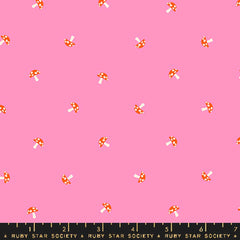 Pattern of small mushrooms on a pink background with ruler