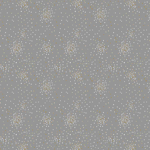 Pattern of small white and yellow metallic clusters of dots on a gray background
