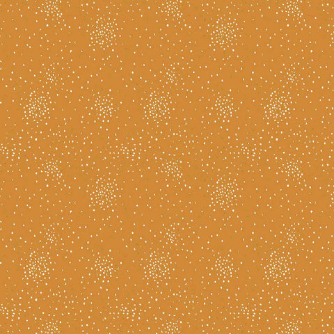 Pattern of small white and yellow metallic clusters of dots on a dark yellow background
