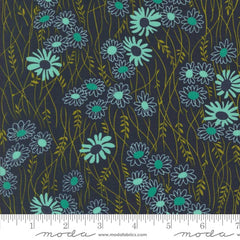 Pattern of green flowers on a dark blue background with ruler