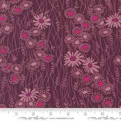 Pattern of pink flowers on a purple background with ruler