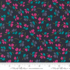 Pattern of pink, purple, and teal flowers on a dark blue background with ruler