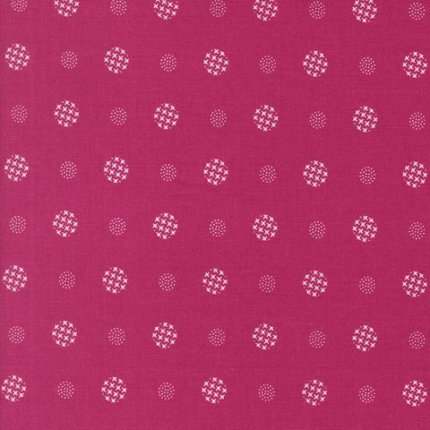 Patterned fabric with white geometric shapes on a magenta background