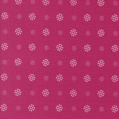 Patterned fabric with white geometric shapes on a magenta background