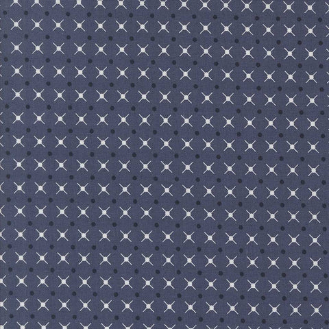 Patterned fabric with a geometric design on an indigo blue background