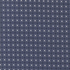 Patterned fabric with a geometric design on an indigo blue background