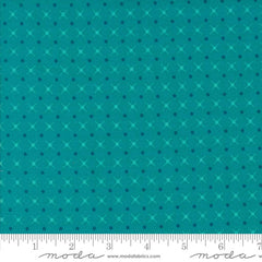 patterned fabric with a geometric design on a blue background with ruler