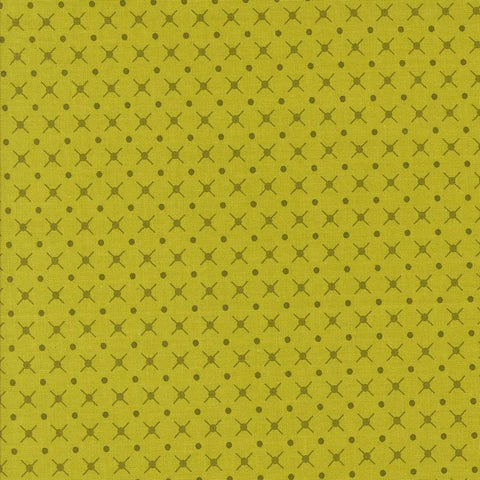Patterned fabric with a geometric design on a green background