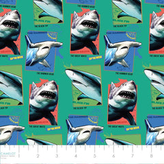 Pattern of shark badges on a green background with ruler