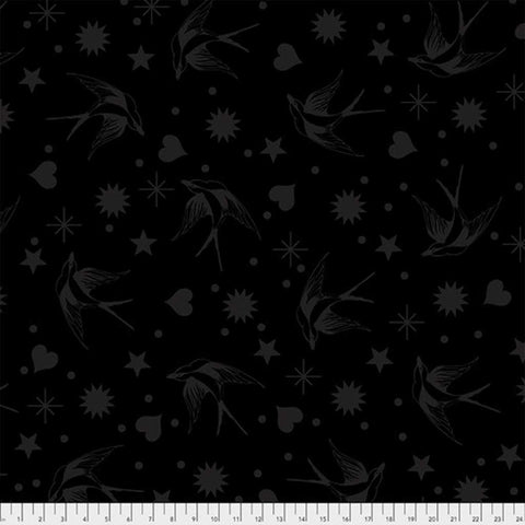 Pattern of gray birds, stars, hearts, and dots on a black background with ruler