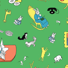 Design of the children's book "Goodnight Moon" featuring a sleeping rabbit in bed, playful cats, a rocking chair, and other elements on a green background