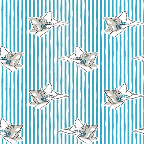 Pattern of rabbits nestled in beds set against a background of blue and white vertical stripes