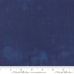 Dark blue grunge blender with ruler