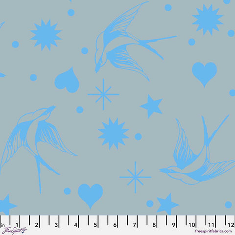 Pattern of blue birds, hearts, stars, and dots on a gray background with ruler
