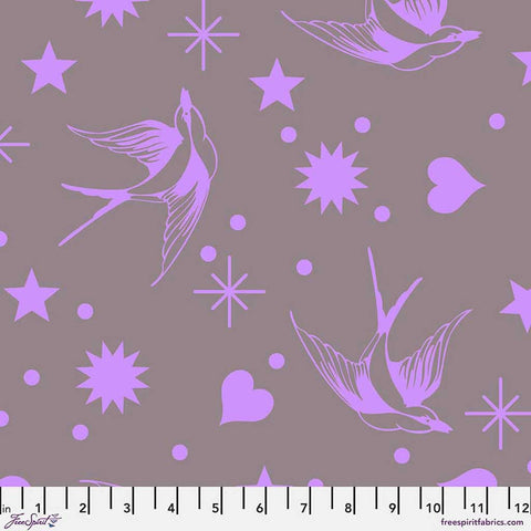 Pattern of purple birds, hearts, stars, and dots on a gray background with ruler