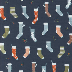 Pattern of colorful Christmas stockings on a dark blue background