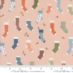 Pattern of colorful Christmas stockings on a pink background