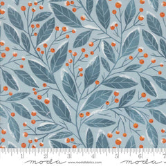 Pattern of blue leaves and orange berries on a light blue background with ruler