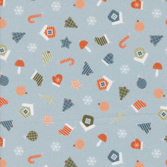 Patterned fabric with Christmas-themed elements on a light blue background