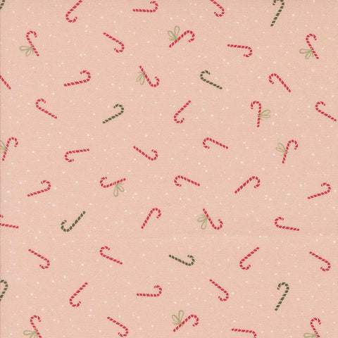 Pattern of red and green candy canes on a pink background