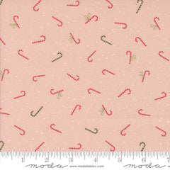Pattern of red and green candy canes on a pink background with ruler