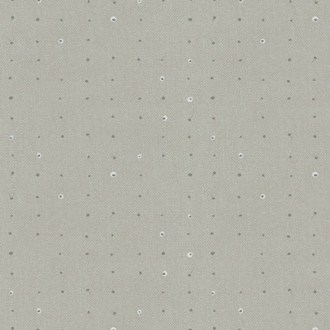 Pattern of small dots arranged in a grid on a gray background