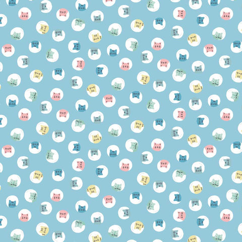 Pattern of cats inside white circles on a blue background