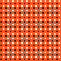 Pattern of small black and white squares on an orange background