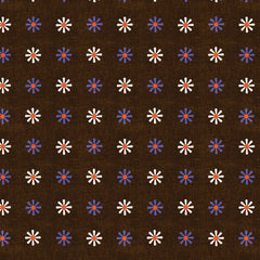 Pattern of small blue and white flowers on a brown background