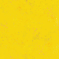 Pattern of multi-colored speckles on a yellow background