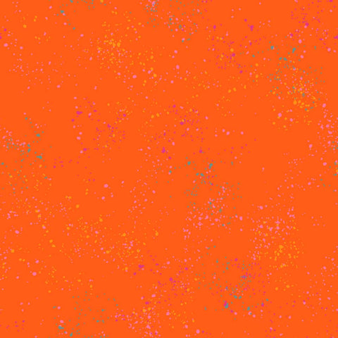 Pattern of multi-colored speckles on an orange background